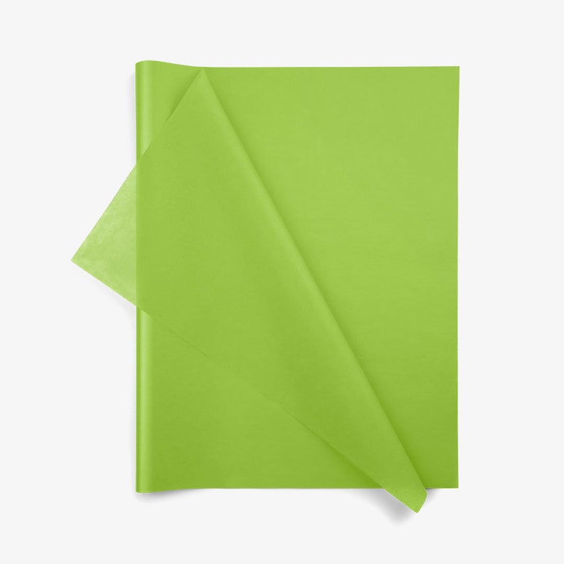 May include: A rectangular sheet of lime green tissue paper with a semi-transparent quality. The paper is folded over at the top left corner, revealing a lighter, more translucent layer of the same vibrant green color against the main sheet.