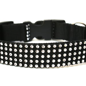 May include: Black dog collar with a row of silver rhinestones.
