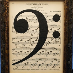 Bass Clef Music Note Art Print on Antique Music Book Page