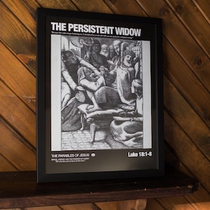 May include: A framed black and white print titled "The Persistent Widow" featuring a detailed illustration of a biblical scene. The print is displayed on a wooden shelf against a wood-paneled wall. The text "Luke 18:1-8" is visible.