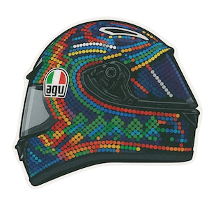 May include: A motorcycle helmet featuring a vibrant dot pattern in blue, green, yellow, orange, and red. The helmet has a black visor and the AGV logo with the Italian flag. The design covers the entire helmet surface.