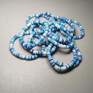 May include: A rustic wooden sign with the text "Welcome to our home" in white lettering. The sign has a distressed finish and a simple, inviting design, ideal for entryway decor.