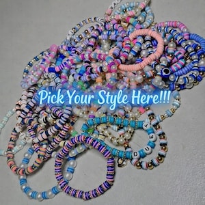 May include: A collection of colorful beaded bracelets in various styles. The bracelets feature a mix of pastel and vibrant colors, with some incorporating pearls and letter beads. The text "Pick Your Style Here!!!" is displayed across the image.