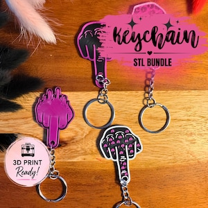 Könnte beinhalten: Eine Sammlung von Schlüsselanhängern mit verschiedenen Designs, darunter eine Handgeste, mit silbernen Schlüsselringen. Die Schlüsselanhänger sind in Pink- und Schwarztönen gehalten. Der Text "Keychain STL BUNDLE" ist sichtbar.