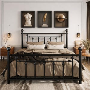 May include: A black metal bed frame with a headboard and footboard. The bed is made up with tan bedding and pillows. Two wooden nightstands with lamps flank the bed. Above the bed are three framed wall art pieces.