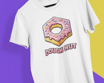 May include: White t-shirt featuring a pink, hexagon-shaped donut graphic with sprinkles and the text "DOUGH NUT" in a bold font. The donut has a yellow base and a pink frosting with blue, yellow, and pink sprinkles.