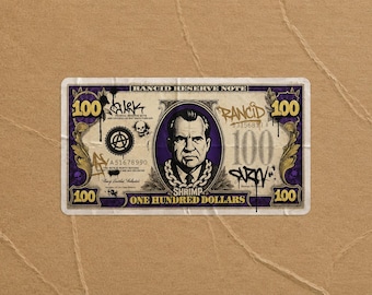 May include: A rectangular sticker designed as a Rancid Reserve Note one hundred dollar bill. It features a portrait of Richard Nixon wearing a chain, purple accents, graffiti-style text, an anarchy symbol, and a skull. The text reads Rancid Reserve Note, 100, Shrimp, and One Hundred Dollars.