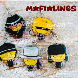 May include: Five acrylic charms featuring cartoon characters with yellow faces, black suits, and various hats including fedoras and top hats. The text MAFIALINGS is printed in large red letters at the top. Each charm has a silver metal clasp.