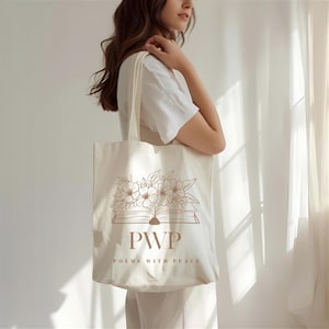 May include: Cream-colored tote bag with a floral and book design. The bag features the letters "PWP" and the words "Poems With Peace" printed in a brown color. The tote bag has two handles and is made of a soft fabric.