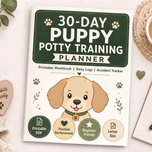 a book titled "30-Day Puppy Potty Training Planner" with a cartoon image of a dog on the cover. The book is placed on a table alongside a cup of coffee, a notebook, and a pen.