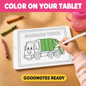 A child's hand is holding a stylus and drawing a picture of a garbage truck on a tablet, with crayons and a pink sippy cup nearby.