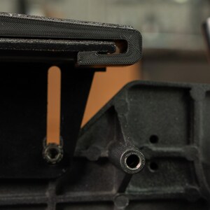 Side view showing the shallow 46 inch curve of the Rayzor Edge platen, ideal for thinning kitchen cutlery.