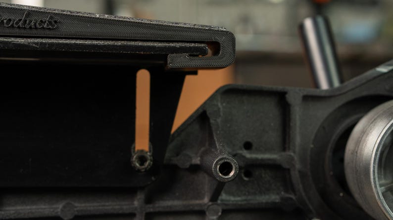 Side view showing the shallow 46 inch curve of the Rayzor Edge platen, ideal for thinning kitchen cutlery.