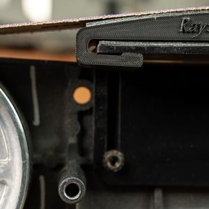 Side view showing the shallow 46 inch curve of the Rayzor Edge platen, ideal for thinning kitchen cutlery.