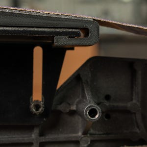 Side view showing the shallow 46 inch curve of the Rayzor Edge platen, ideal for thinning kitchen cutlery.