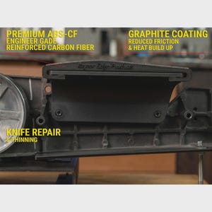 May include: A black knife repair and thinning tool featuring a graphite coating for reduced friction and heat build-up. The device is constructed from premium ABS-CF engineer grade reinforced carbon fiber and displays the text Rayzor Edge Products.