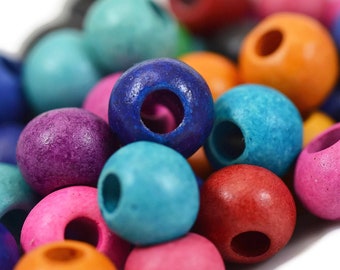 May include: A collection of round wooden beads in a variety of vibrant colors including blue, purple, pink, orange, red, and turquoise. Each bead features a central hole for stringing, with a matte finish that highlights the natural wood texture.