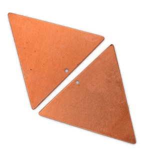 May include: Two copper triangle shapes with holes in the center. The triangles are slightly different sizes and are laying flat on a white background.