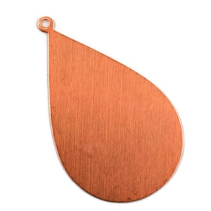 May include: A flat, teardrop-shaped pendant made of copper with a brushed metallic finish. The pendant features a small, circular hole at the narrow top point, designed for attachment to a chain or cord, presenting a simple, unadorned surface.