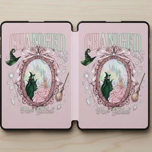 May include: A pink tablet case featuring a whimsical illustration from the musical "Wicked." The design includes the words "Changed" and "For Good," along with images of the Wicked Witch of the West, Glinda, and the Emerald City.