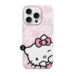 Puede incluir: Funda transparente para tel&eacute;fono con fondo rosa y un patr&oacute;n repetido de lazos. La funda presenta un personaje de dibujos animados con cabeza blanca, lazo rosa y gui&ntilde;o. Recorte para la c&aacute;mara.