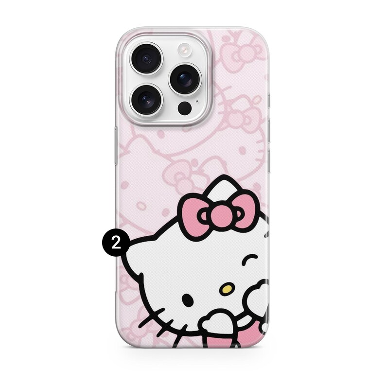 Puede incluir: Funda transparente para tel&eacute;fono con fondo rosa y un patr&oacute;n repetido de lazos. La funda presenta un personaje de dibujos animados con cabeza blanca, lazo rosa y gui&ntilde;o. Recorte para la c&aacute;mara.