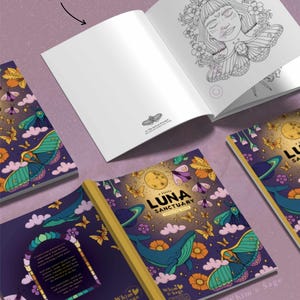 May include: A coloring book titled A Little Luna Sanctuary with a dark purple cover featuring illustrations of a whale, moths, flowers, and a moon. The open book displays a black and white line art illustration of a person surrounded by flowers.