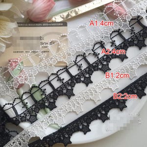 10 yards 2 cm 0.78" breites schwarz/ivory Sterne Stoff Stickerei Kleidung Kleid Rock Hemd Einfassung Material Spitzenbesatz Bänder Band T19X164N200316B