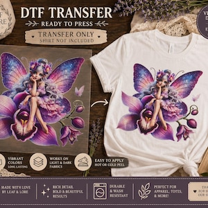 May include: A DTF transfer sheet and a white t-shirt featuring a graphic of a fairy with purple and blue galaxy-patterned wings sitting on a large purple orchid flower. The design includes text such as DTF TRANSFER, READY TO PRESS, and TRANSFER ONLY SHIRT NOT INCLUDED.