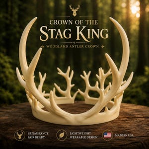 May include: Cream-colored antler crown with the text "CROWN OF THE STAG KING" and "WOODLAND ANTLER CROWN". The crown is made of a lightweight, wearable design and is Renaissance fair ready. Made in the USA.