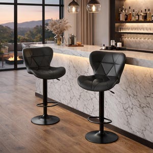 May include: Two black bar stools with diamond-stitched seats and adjustable height. The stools have a round base and footrest. The background includes a bar with liquor bottles and a window with a scenic view.
