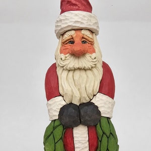 Hand Carved Santa Holding a Wreath