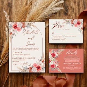 Peut inclure: Ensemble de faire-part de mariage avec des accents floraux et de pampas. La carte d'invitation présente les noms "Charlotte et James" et les détails de l'événement. Cartes RSVP et de détails également incluses, le tout avec un design rustique et élégant.
