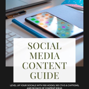 May include: A smartphone with a colourful app display rests on a notebook with a blue spine. A laptop and pen are in the background. The image features text that reads "SOCIAL MEDIA CONTENT GUIDE" and "LEVEL UP YOUR SOCIALS WITH 100 HOOKS, 100 CTA'S & CAPTIONS, AND 90 DAYS OF CONTENT IDEAS."