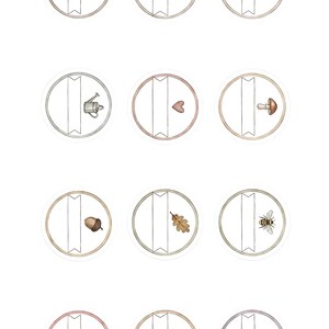 May include: A collection of twelve watercolor stickers, each featuring a circular design with a decorative border. The stickers showcase various nature-inspired illustrations, including a key, bow, teapot, watering can, heart, mushroom, acorn, leaf, bee, strawberry, bird, and lavender.
