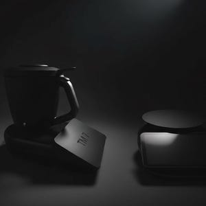Pode incluir: Um conjunto de eletrodom&eacute;sticos de cozinha pretos, incluindo um liquidificador com al&ccedil;a e uma balan&ccedil;a separada. O liquidificador tem um design elegante e moderno. A balan&ccedil;a &eacute; retangular com um topo circular. O texto "TM 7" &eacute; vis&iacute;vel.