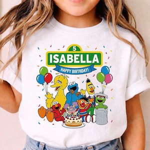 May include: A set of three ceramic mugs with a speckled, matte finish. The mugs are in shades of cream, light gray, and dark gray. Each mug has a simple, minimalist design, perfect for coffee or tea.