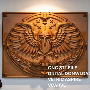 May include: A carved wooden wall art piece featuring a detailed relief of a helmeted figure with wings, stars, and laurel leaves. The artwork is in a rectangular frame. Text on the image reads "CNC STL FILE DIGITAL DOWNLOAD VETRIC ASPIRE VCARVE."