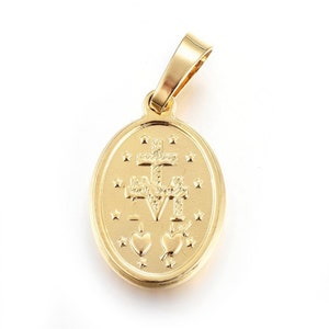 May include: Gold-toned oval pendant with a cross and two hearts, surrounded by stars.