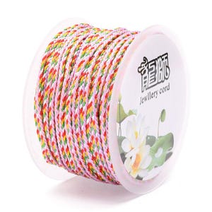 May include: A spool of pink, green, yellow, and red braided cord for jewelry making. The spool is labeled "Jewellery cord" in English and Chinese characters.