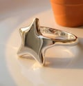 Handmade Sterling Silver Star Ring - Boho Fidget Jewelry – Minimalist Celestial Jewelry product logo