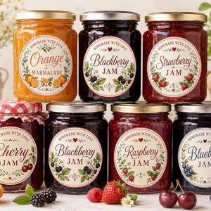 May include: Seven glass jars of fruit preserves with gold lids, except for one with a red and white checkered cloth cover. Labels feature the text Homemade with Love and specific fruit names: Orange Marmalade, Blackberry, Strawberry, Cherry, Raspberry, and Blueberry Jam.