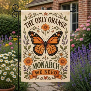 May include: A beige garden flag with a monarch butterfly design. The butterfly is orange and black, surrounded by flowers and the text "THE ONLY ORANGE MONARCH WE NEED". The flag is displayed on a black metal stand.