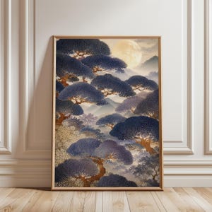 May include: A framed wall art print featuring a landscape painting of dark blue, rounded pine trees set against a pale yellow full moon and misty mountains. The artwork displays a layered composition of textured foliage and brown tree trunks.