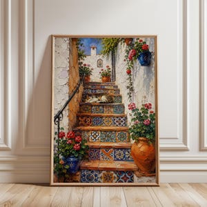 May include: An oil painting in a wooden frame depicting a stone staircase with colorful patterned tiles. A cat rests on the steps, surrounded by terracotta pots filled with vibrant red geraniums. A black wrought iron railing lines the side.