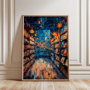 以下が含まれることがあります： 本屋の内装を描いた額入りのアートプリント。本棚に並んだ本、吊り下げられたランプからの温かい光、大きな窓から見える街の景色が描かれています。色使いは青、オレンジ、茶色です。