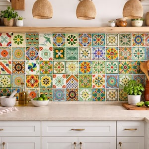 May include: A kitchen backsplash featuring a vibrant array of colorful, patterned tiles. The tiles are arranged in a grid, showcasing floral and geometric designs in shades of blue, green, yellow, and red. The kitchen also includes wooden utensils, plants, and a white countertop.