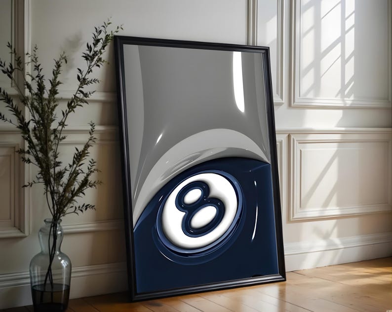May include: Framed art print featuring a glossy, abstract design of the number eight in white against a navy blue and gray background. The artwork is encased in a black frame and leans against a white wall.