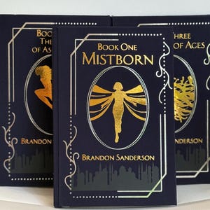 Libros de la trilogía Mistborn con encuadernación personalizada – Diseño en tela azul, oro y plata de Brandon Sanderson - Ediciones de gran formato