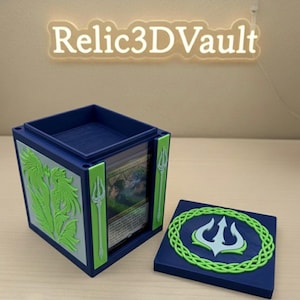 May include: A blue card storage box with a removable lid, featuring green and gray accents. The box has a green trident design and the text "Relic3DVault" in a neon sign. The lid has a green and white trident design.